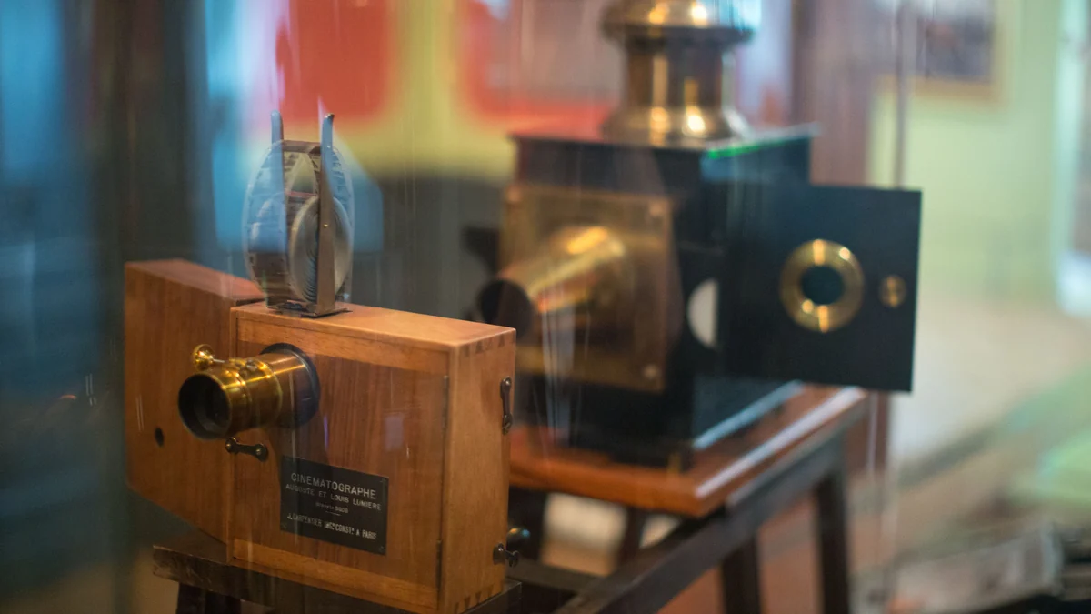 Wooden cinematograph displayed behind glass