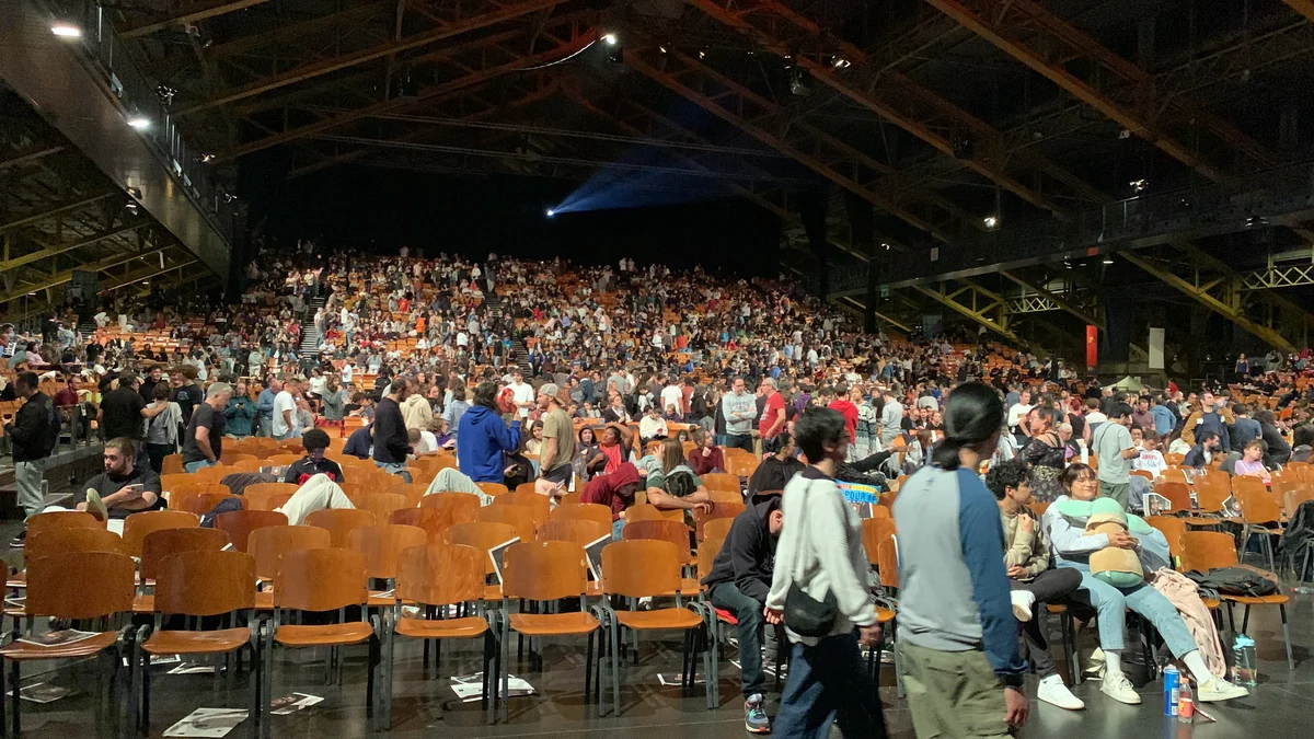 Audience members fill the stands and seats at Halle Tony Garnier during an intermission