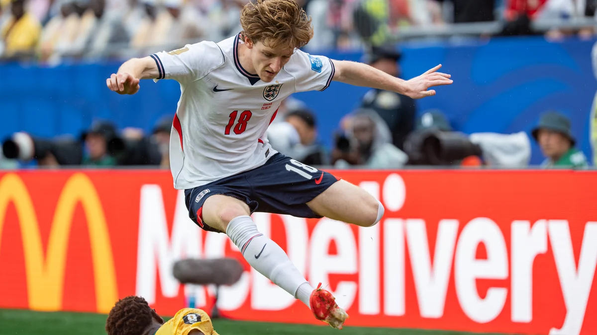 Anthony Gordon, wearing England's white shirt, jumps during a play against Ghana.