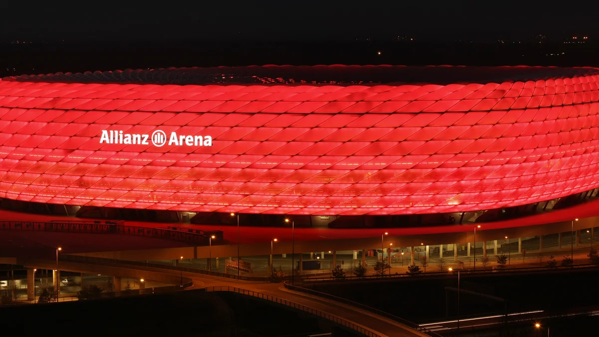Exterior of the Allianz Arena illuminated red at night