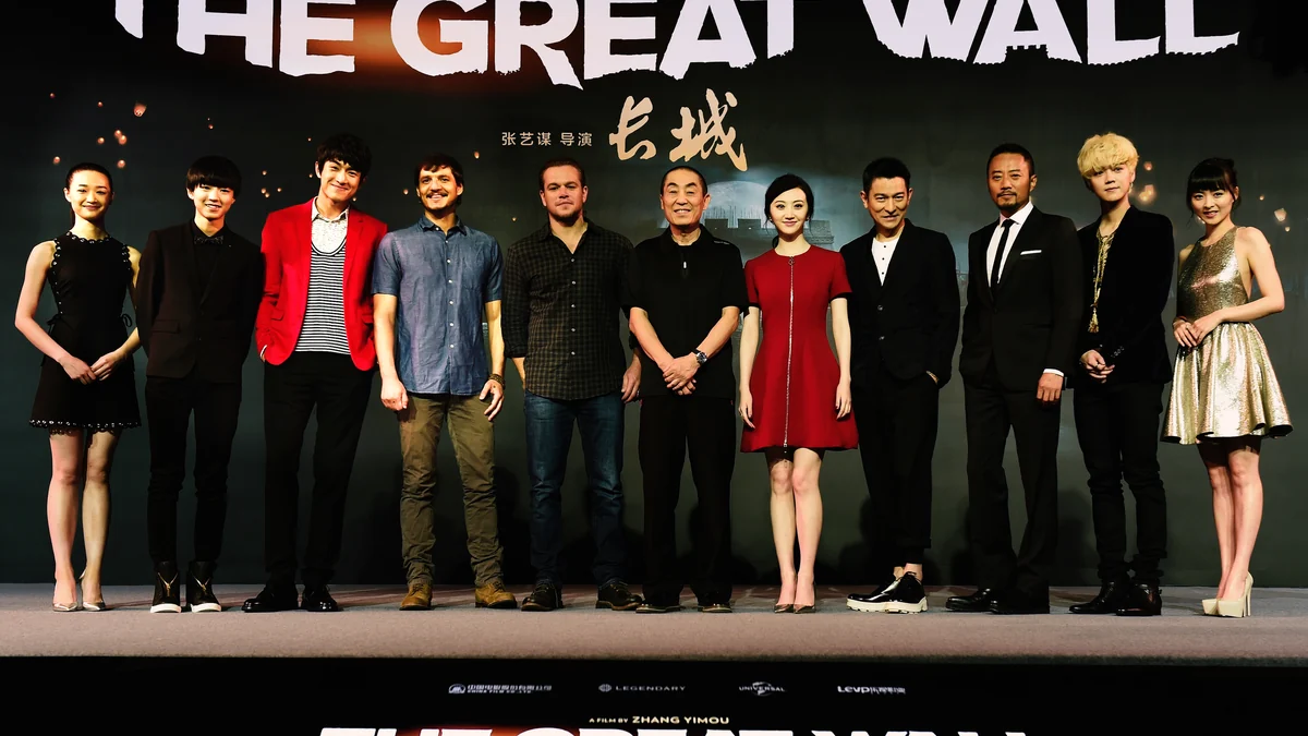 Zhang Yimou at center with actors and crew members from The Great Wall on a stage