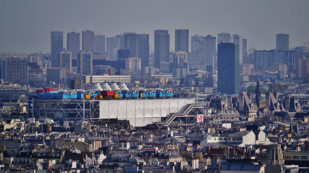 Centre Pompidou among the rooftops of Paris, seen from a distance