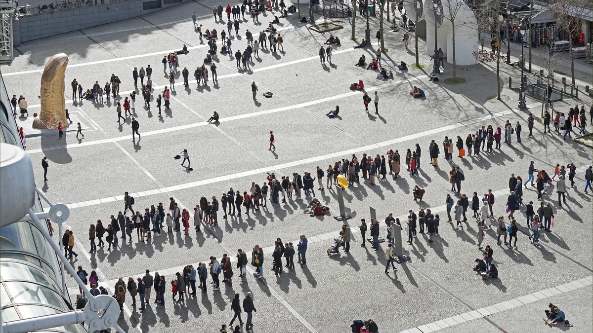 People gathered and walking across the Centre Pompidou Piazza
