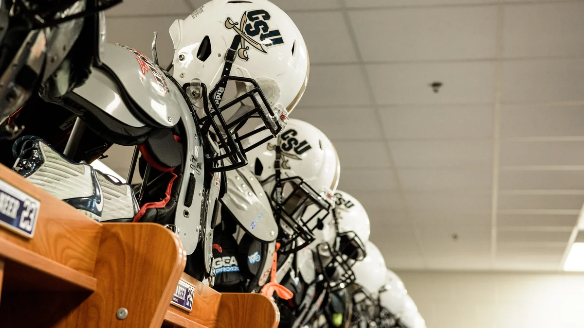 White Charleston Southern football helmets lined up in lockers