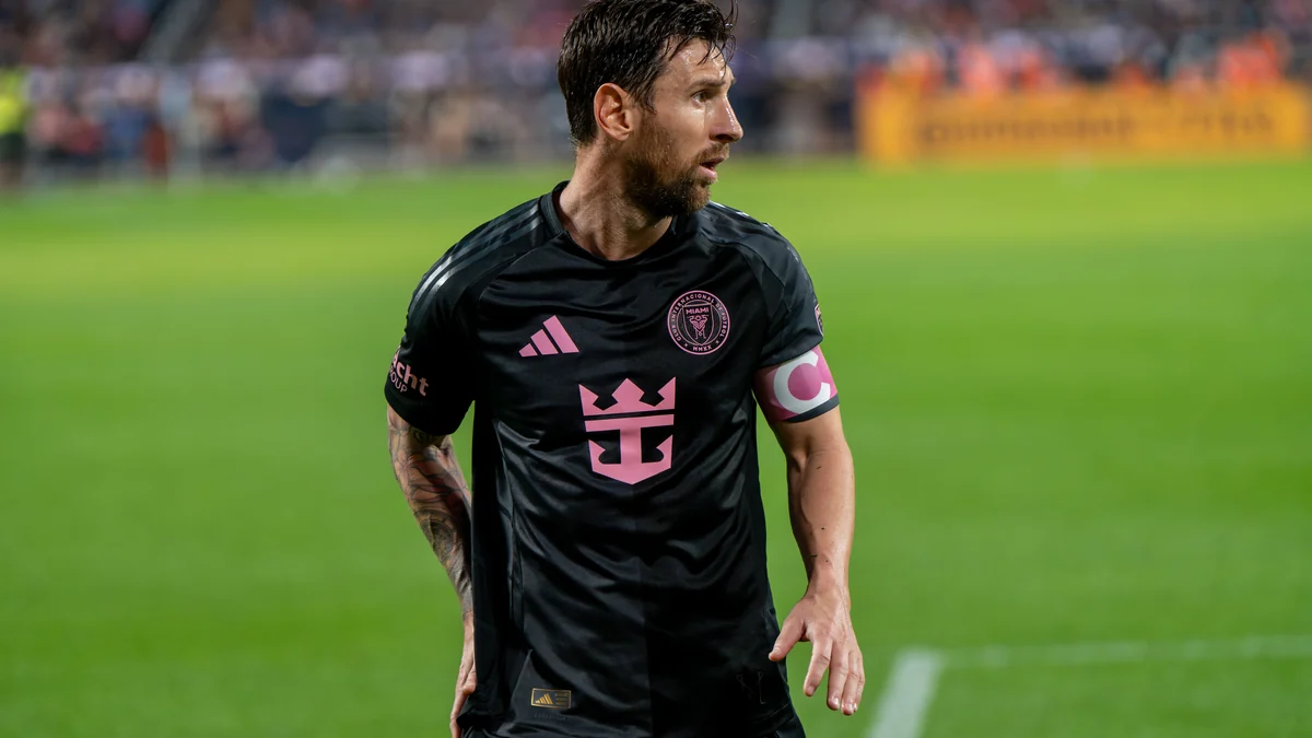Lionel Messi on the field in Inter Miami’s black kit and pink captain’s armband