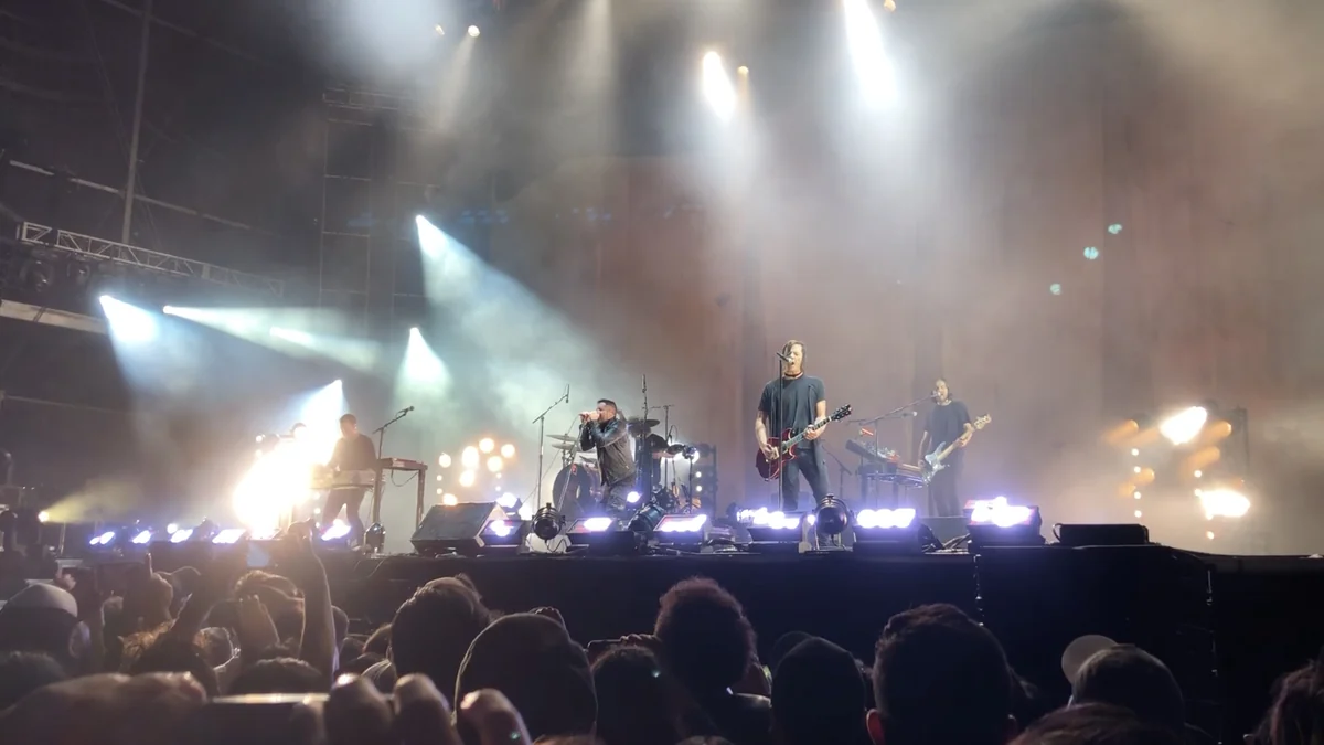 Band performs on a brightly lit stage before the crowd at Corona Capital