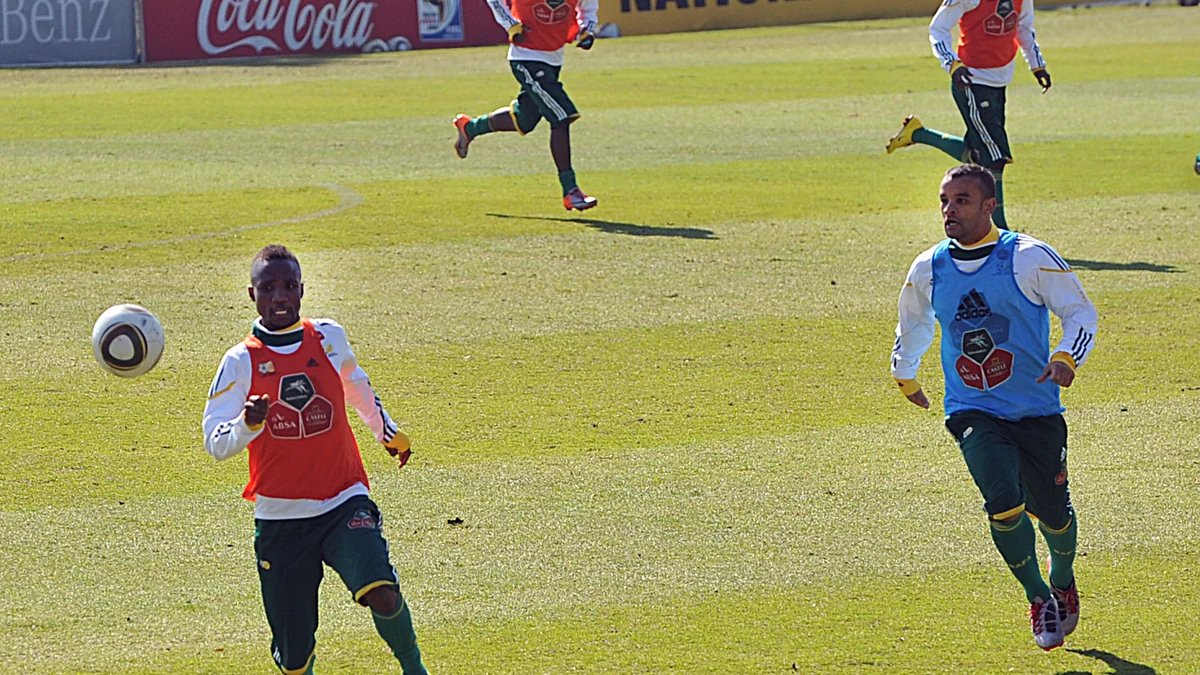Two South Africa players track the ball during a training session