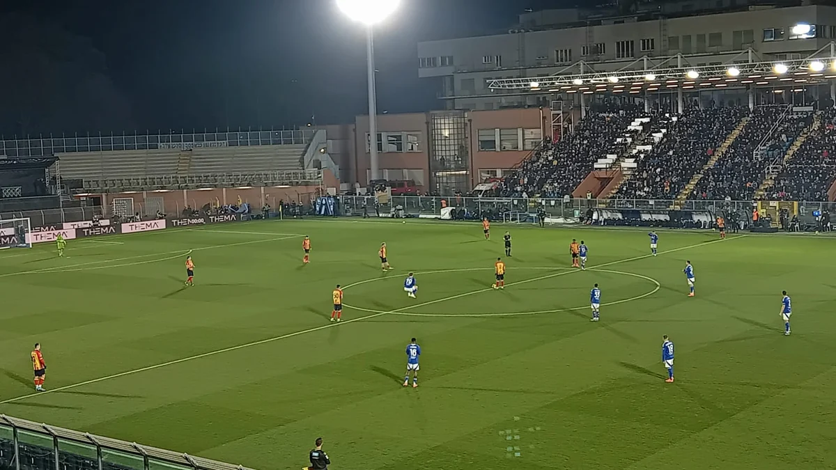 Players in blue and in yellow and red positioned across the Sinigaglia pitch