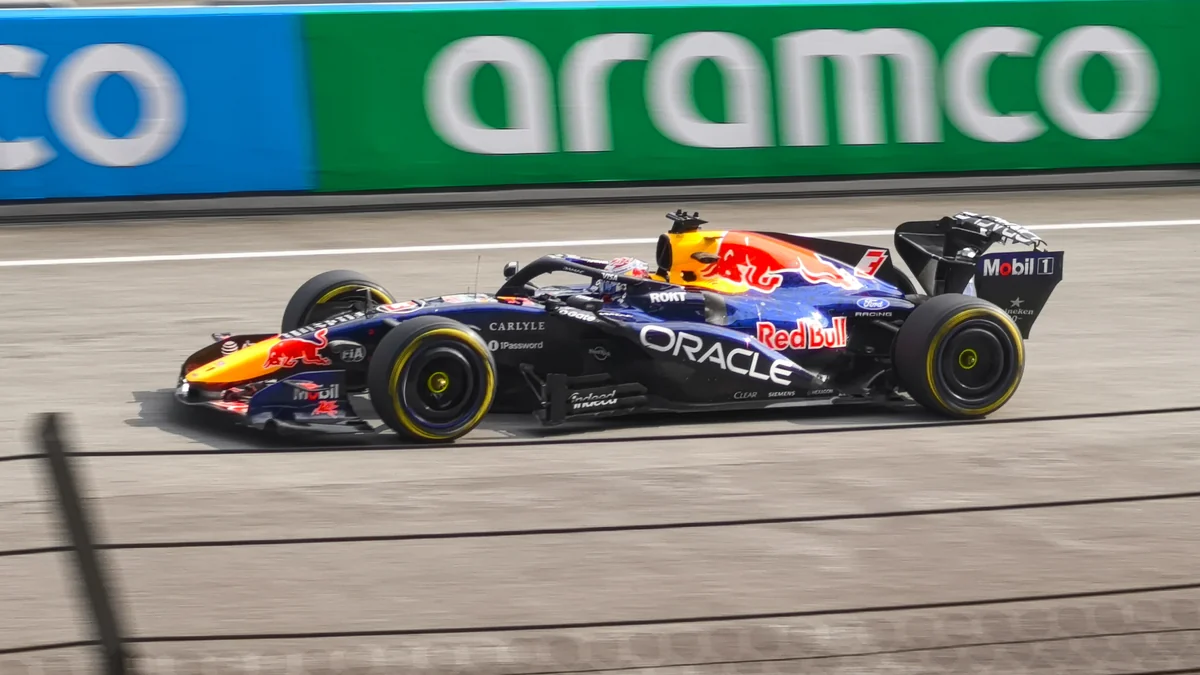 Max Verstappen’s Red Bull seen from the side on a Formula 1 track.