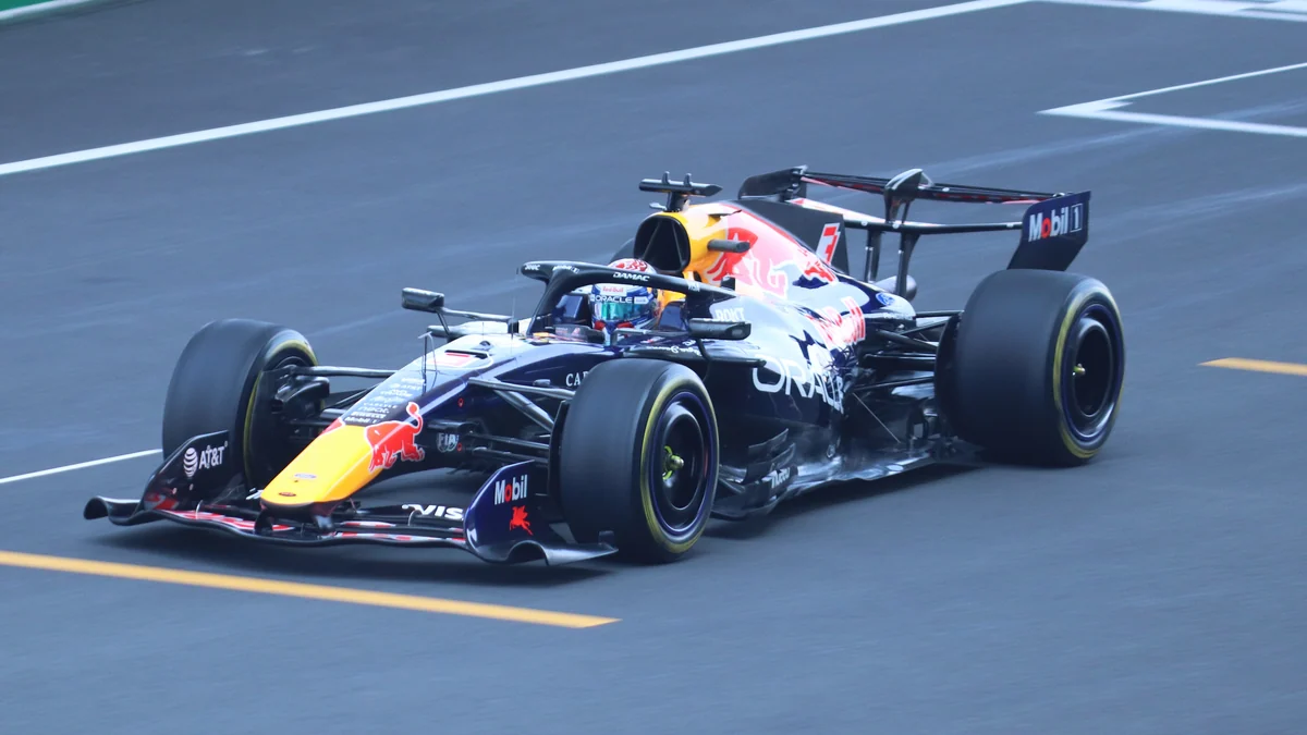 Max Verstappen’s Red Bull photographed from a front three-quarter angle on track.