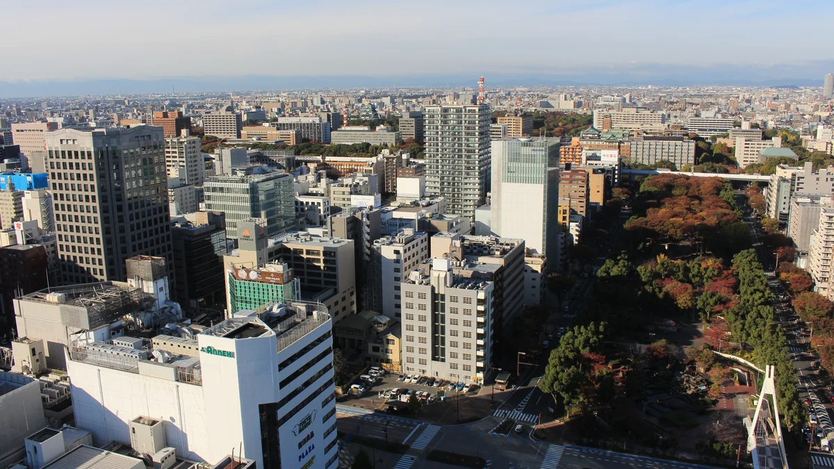 Elevated view of Nagoya buildings and the tree-lined corridor of Hisaya-odori Park