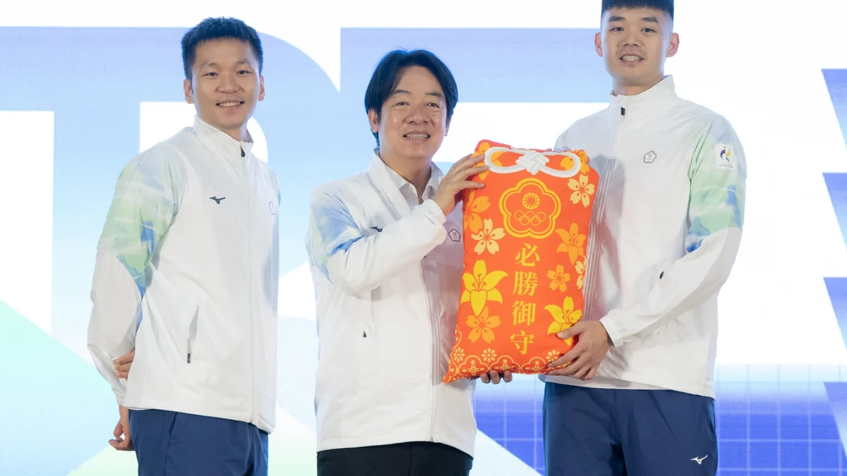 Three men in white sports jackets jointly hold a red object decorated with flowers and Chinese characters.