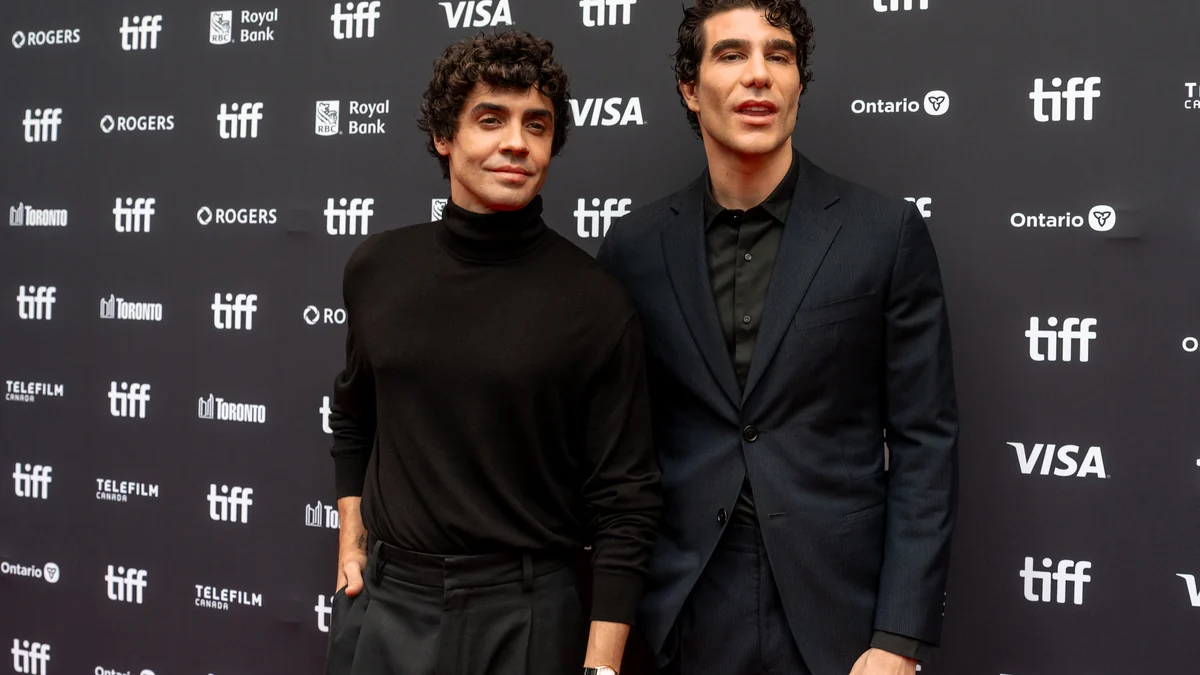 Javier Calvo and Javier Ambrossi pose in front of a TIFF backdrop