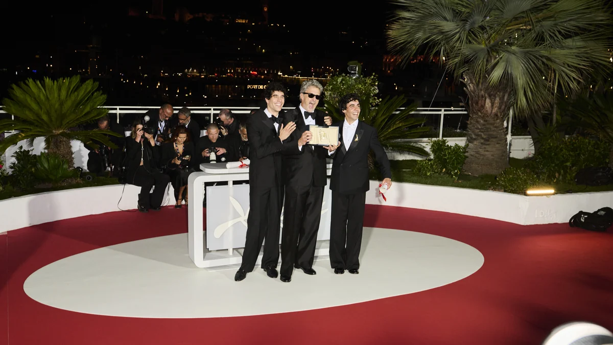 Javier Calvo, Paweł Pawlikowski and Javier Ambrossi pose with an award at the Cannes Film Festival