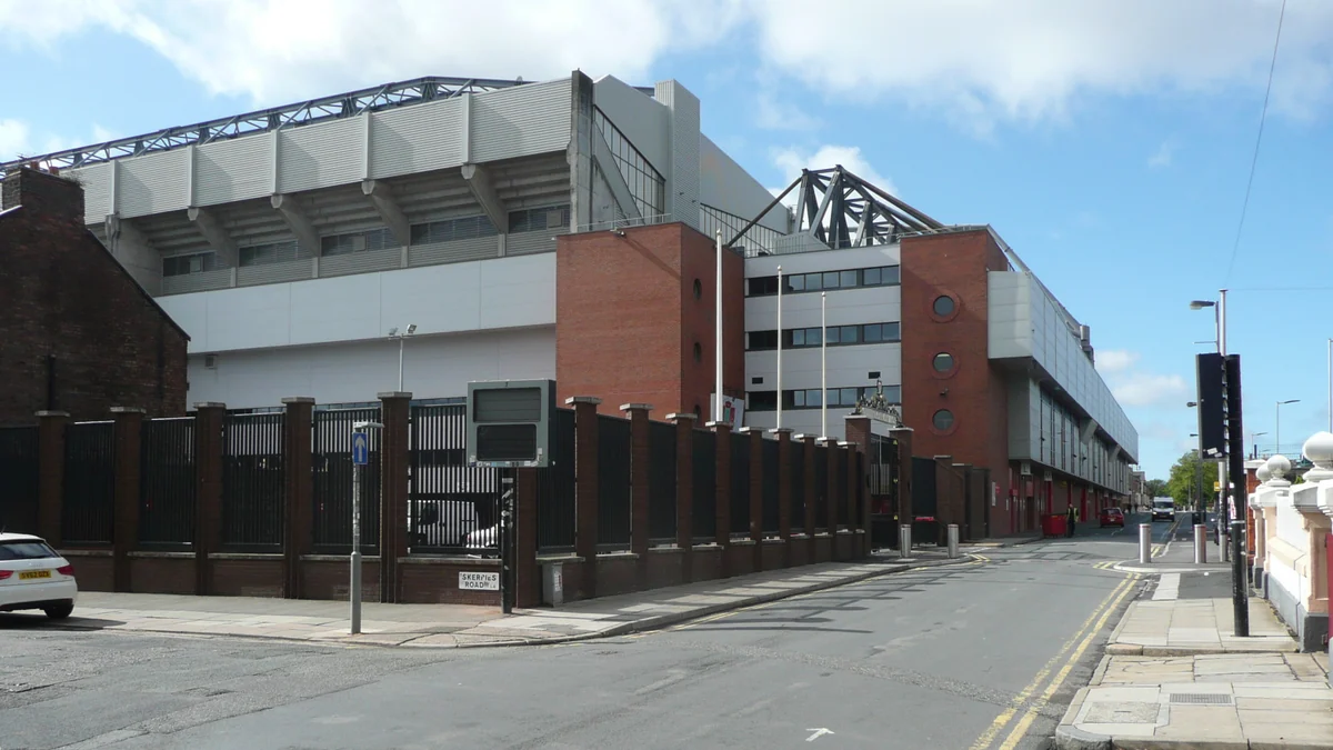 Exterior structure of Anfield stadium seen from a residential street