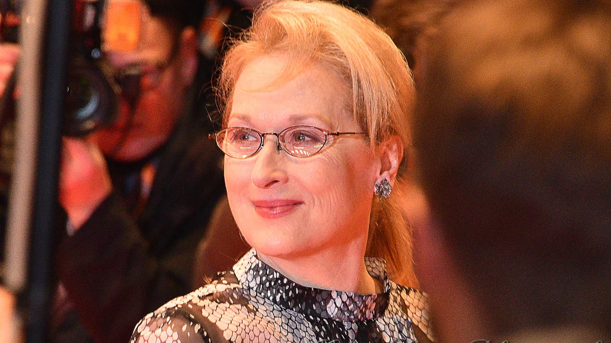Meryl Streep wearing glasses in a close-up at a film event
