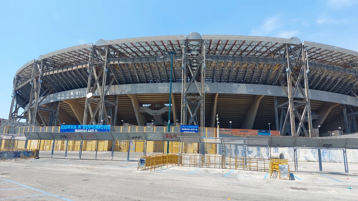 Exterior structure of Stadio Diego Armando Maradona under a blue sky