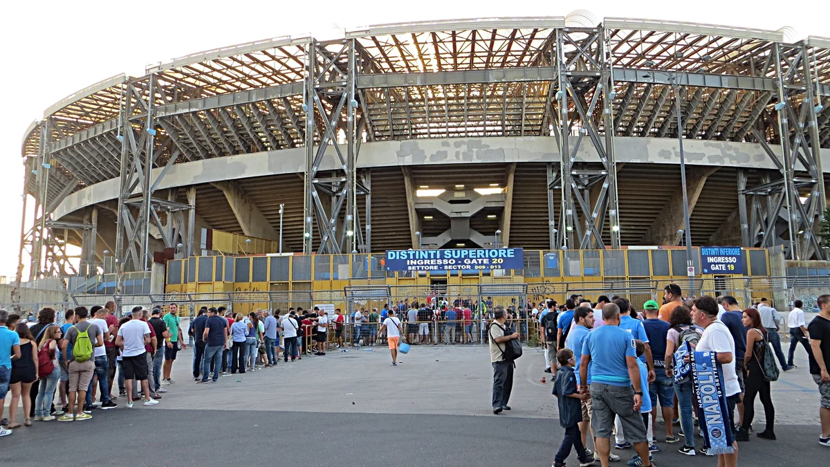 Supporters queue outside an entrance to Napoli’s stadium