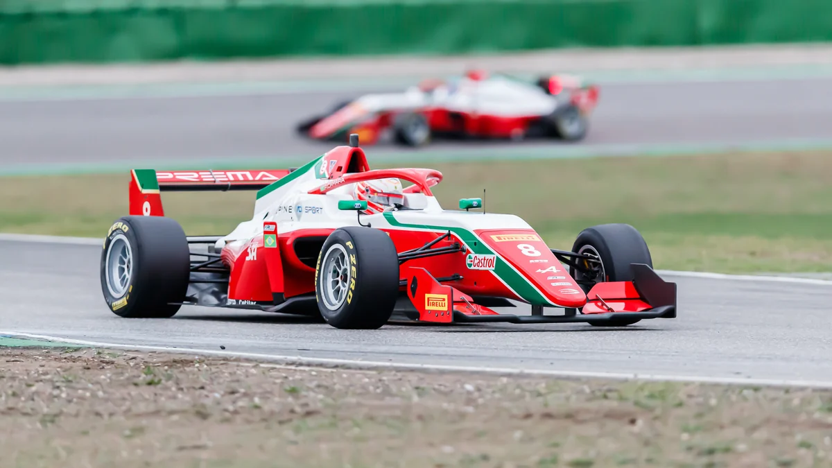 Rafael Câmara drives a red, white and green single-seater through a corner