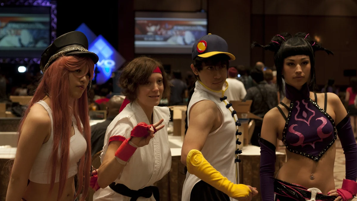Four event attendees wearing cosplay inspired by Street Fighter characters